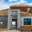 home construction with wood frame roof and concrete base